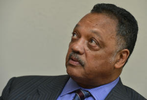 Civil rights leader Rev. Jesse Jackson answers questions from the press after his speech at Bethlehem Missionary Baptist Church in Richmond, Calif., on